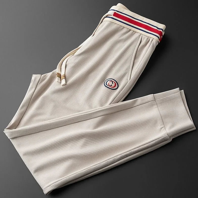 Ribbed women's athletic joggers with stretch fabric & striped waistband. Perfect for casual wear & active days.