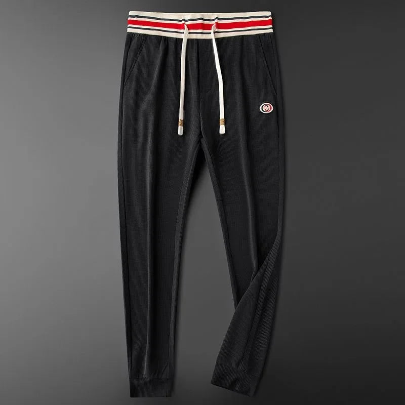 Black women's comfortable ribbed athletic joggers. Ideal for lounge, light activity, or casual everyday wear.
