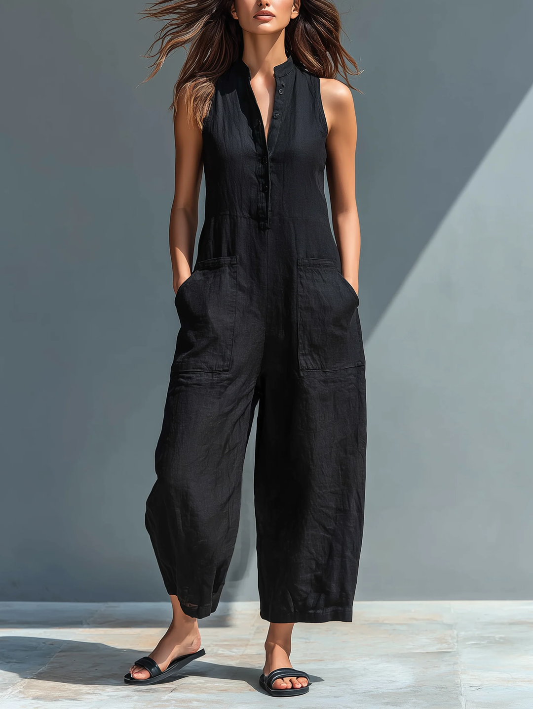 Women's comfortable sleeveless loose-fitting black jumpsuit for casual summer wear. Versatile & chic style.