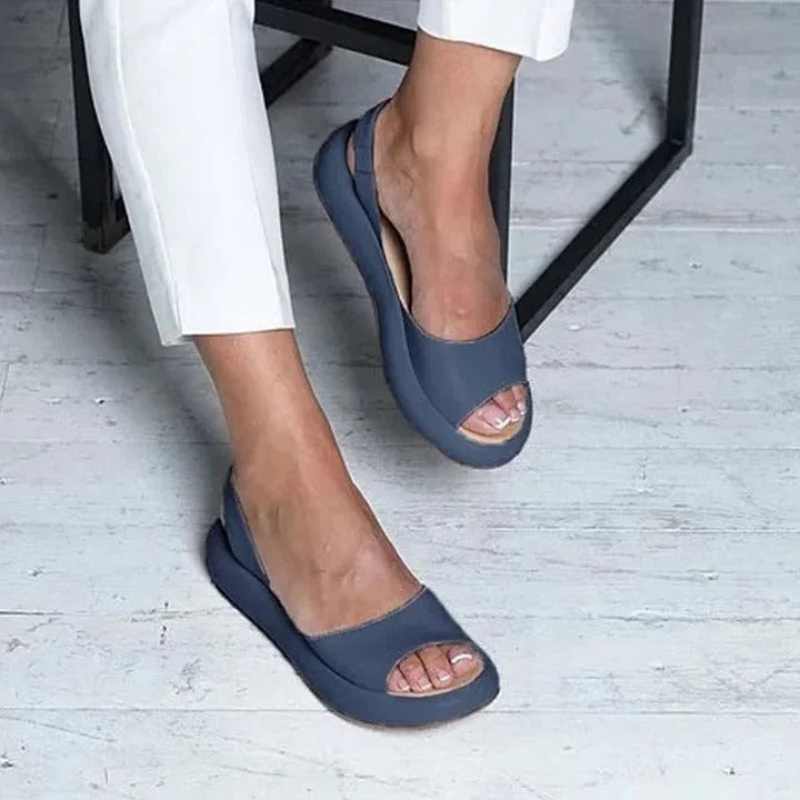 Comfortable women's open-toe slip-on sandals, cushioned footbed & elastic for casual summer style.