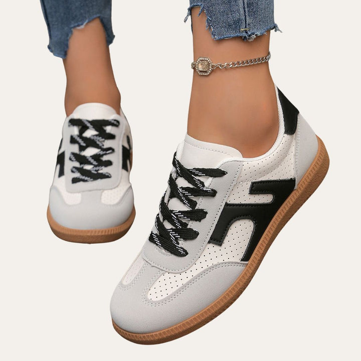 Women's comfortable white low top casual sneakers for everyday wear, versatile spring footwear.