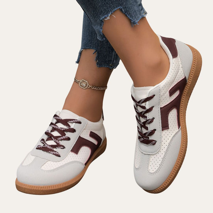 Pair of women's comfortable low top casual sneakers, ideal for spring fashion and versatile styling.