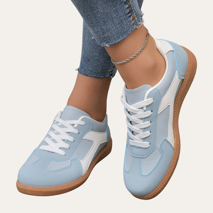 Stylish women's sneakers, low top design for casual outfits and comfortable walking.