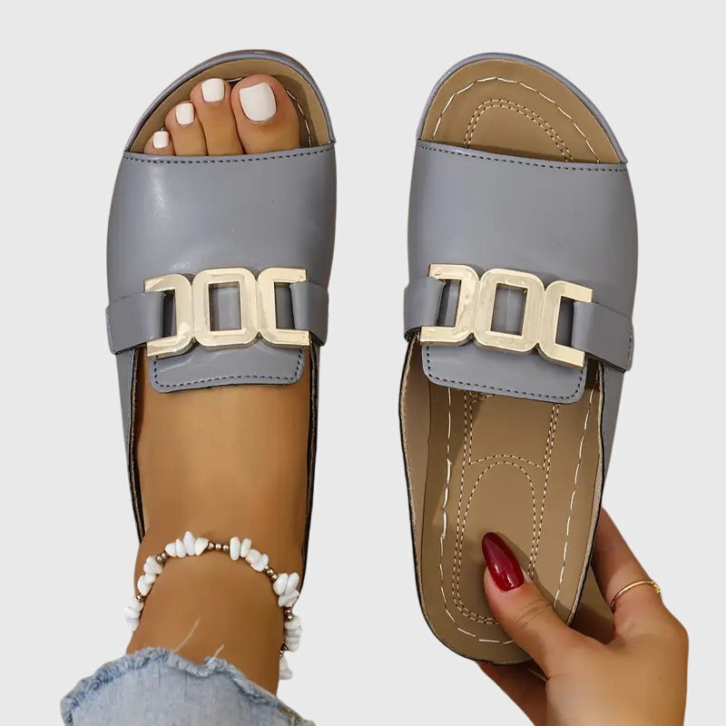 Trendy casual women's buckle sandals, perfect for summer fashion, featuring a comfortable slip-on style.