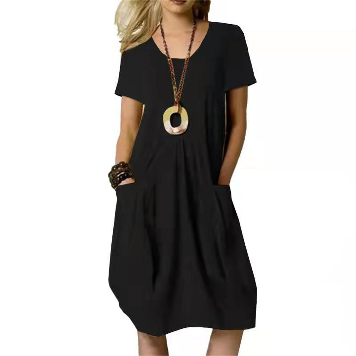Casual knee-length women's summer swing dress with short sleeves and convenient pockets. Solid color, relaxed fit.