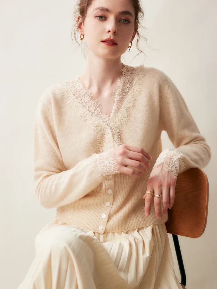 Cortona Lace Cashmere Cardigan draped over a chair, showing its soft knit and quality.