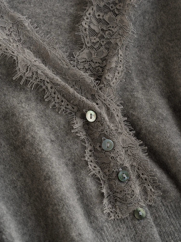 Women's luxurious Cortona Cashmere Cardigan, showcasing its delicate lace trim.