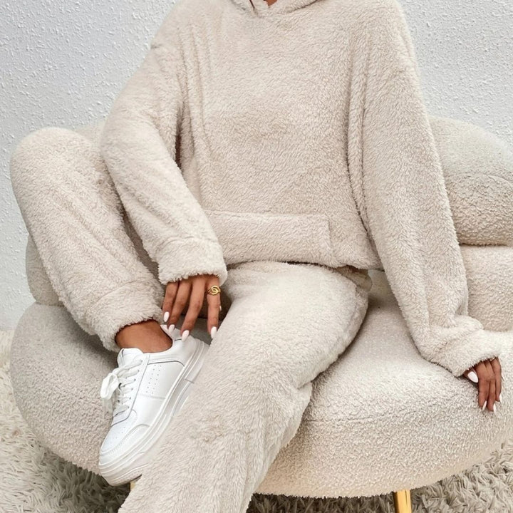 Comfortable women's lounge set with hood, perfect for athleisure looks and relaxing, matching top and bottom.