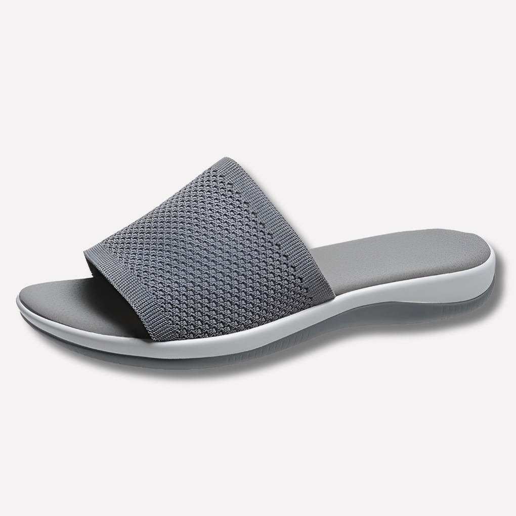 Cozy knit open-toe women's slippers, ideal as breathable indoor footwear. Comfortable flat sole house shoes.