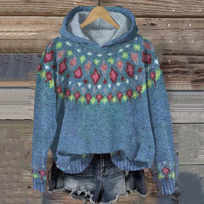 Warm women's hoodie featuring a cozy Nordic pattern. Ideal hooded top for winter, offering comfort & relaxed everyday wear.