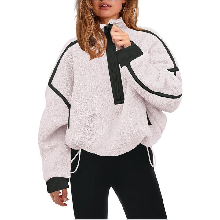 Women's cozy sherpa half-zip pullover in cream, perfect for casual winter fashion and comfort.
