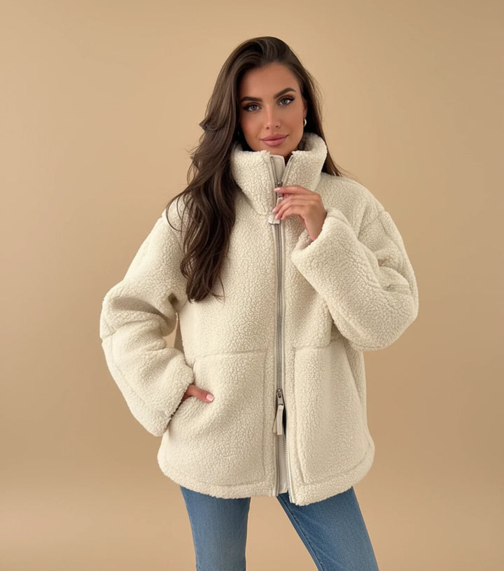 Women's cozy zip-up warm jacket, perfect for fall and winter layering. Comfortable casual outerwear.