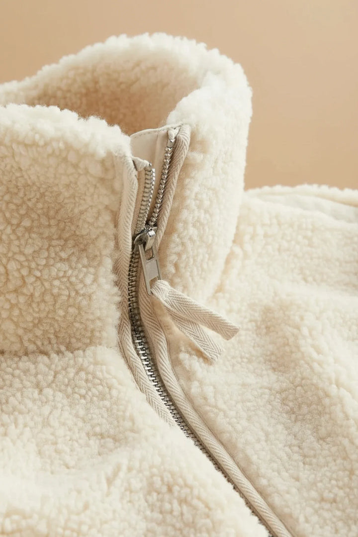 Comfortable white/beige women's cozy zip-up jacket. Ideal warm outerwear for casual fall and winter wear.