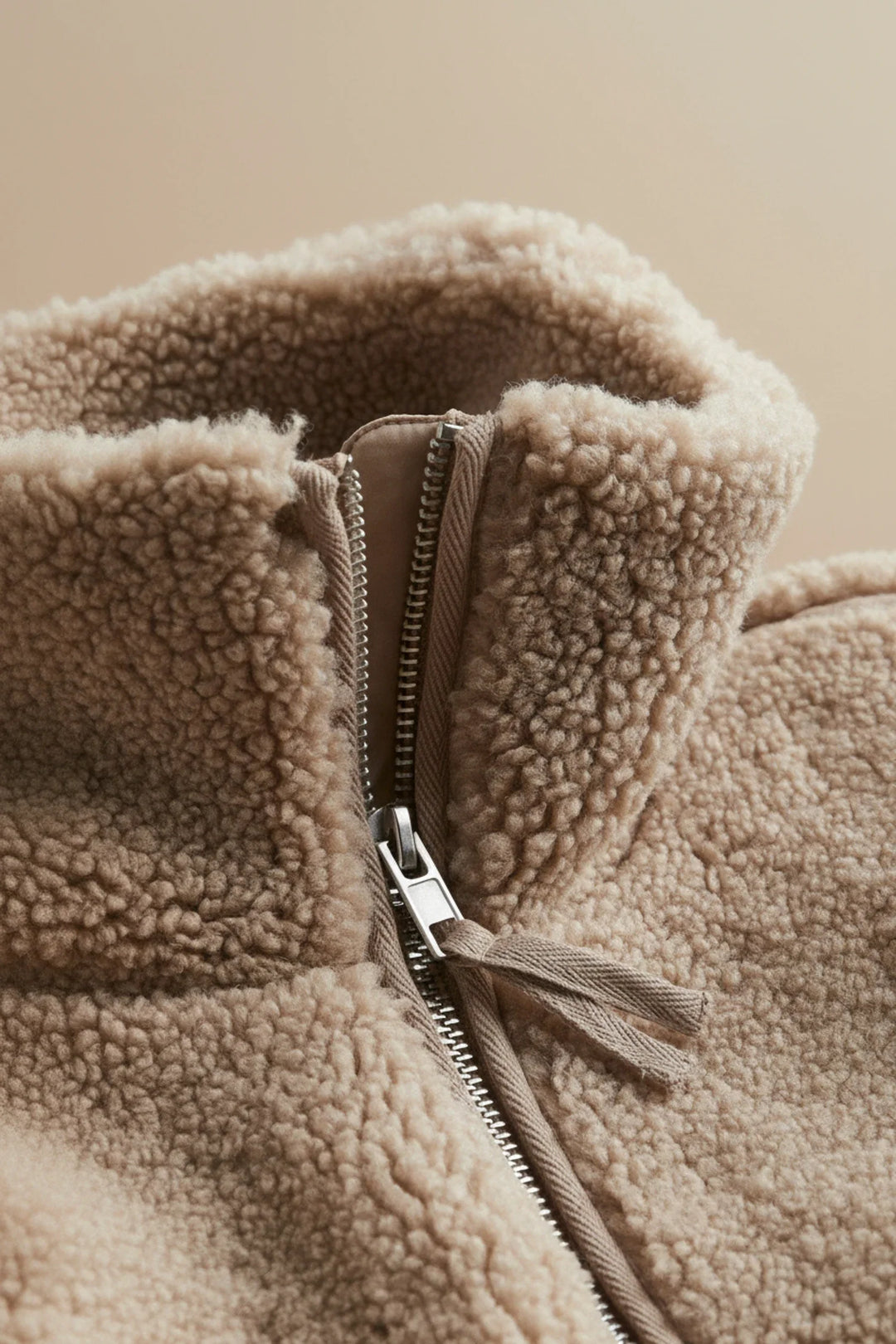Soft, warm women's zip-up jacket with a cozy high collar. Perfect layering piece for cold weather.