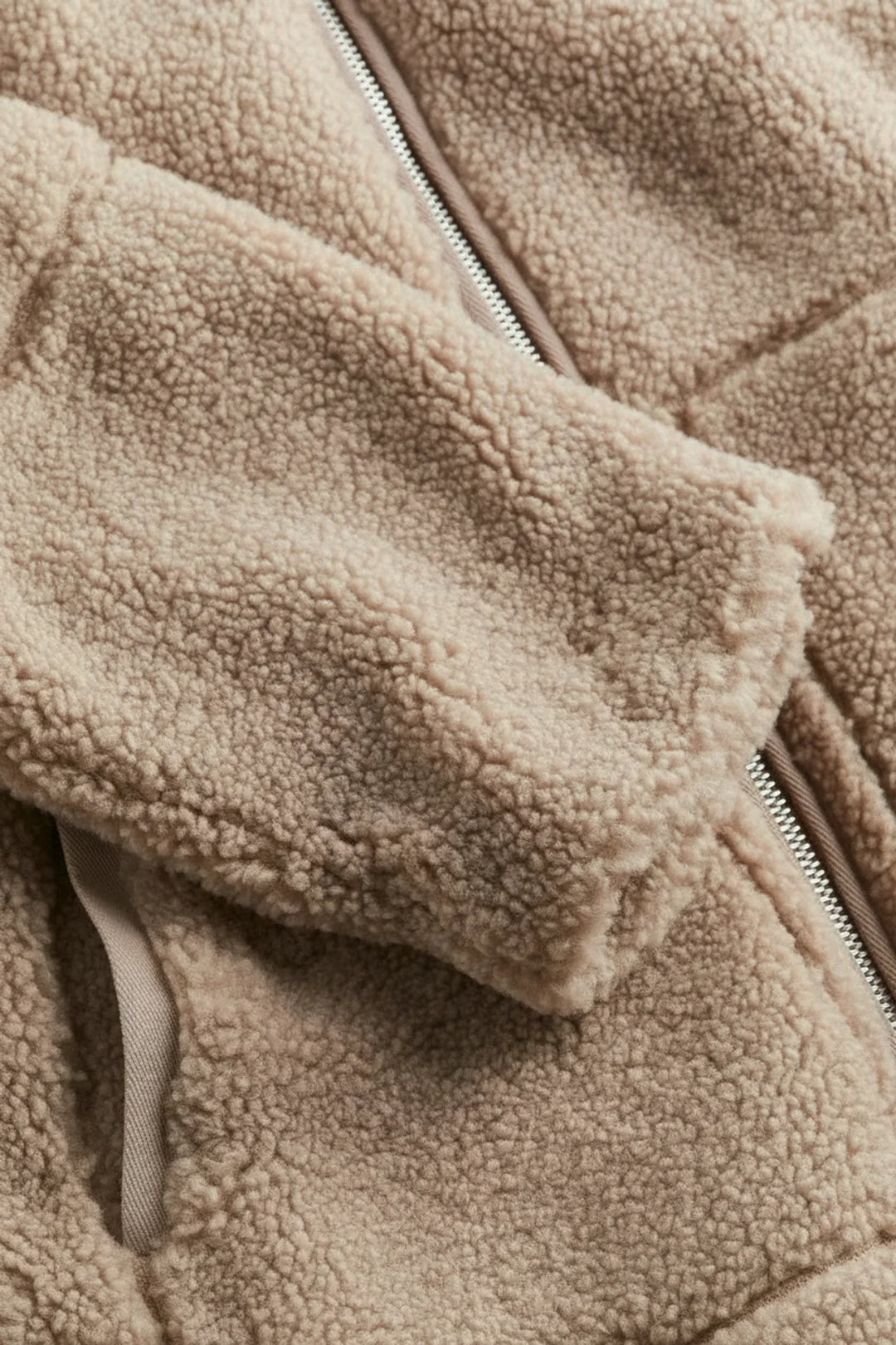 Chic white/beige cozy zip-up jacket for women. A comfortable, warm outerwear staple for everyday fall/winter style.