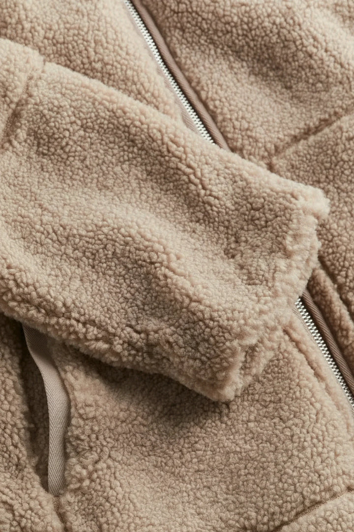 Chic white/beige cozy zip-up jacket for women. A comfortable, warm outerwear staple for everyday fall/winter style.