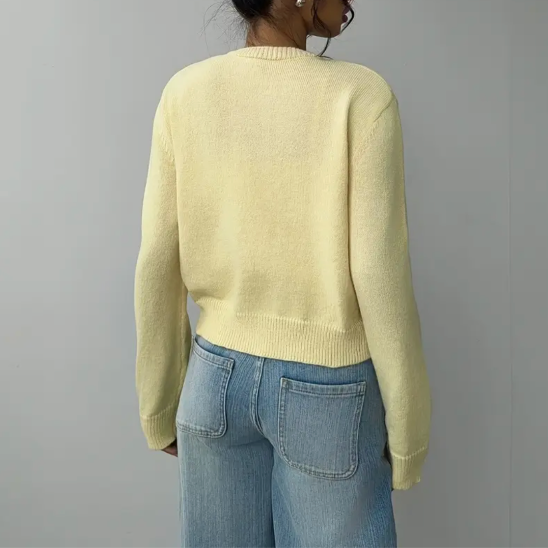 Versatile women's cropped button cardigan in various solid colors shown together, spring/summer.