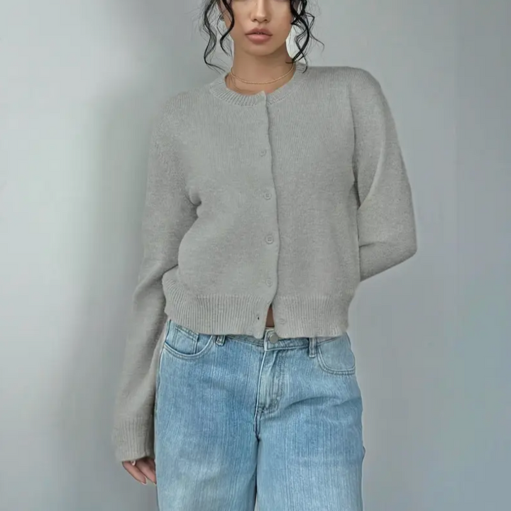 Soft pink women's cropped button cardigan, a comfortable and chic option for summer wear.