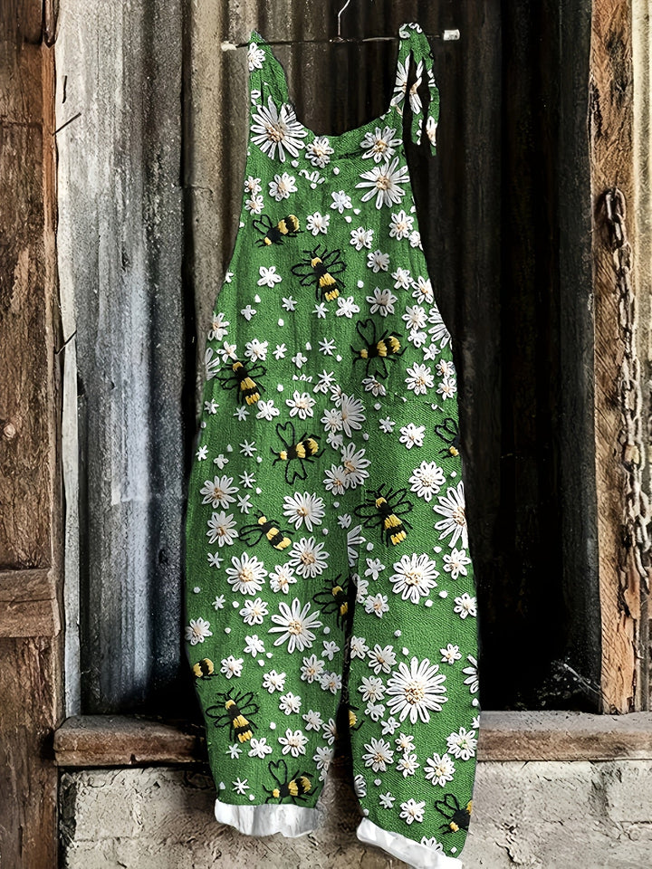 Whimsical daisy bee print women's casual jumpsuit, designed with tie shoulders and a flattering wide leg.