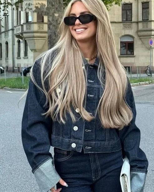 Stylish women's two-piece denim outfit, a cropped jacket and high-waisted pants set