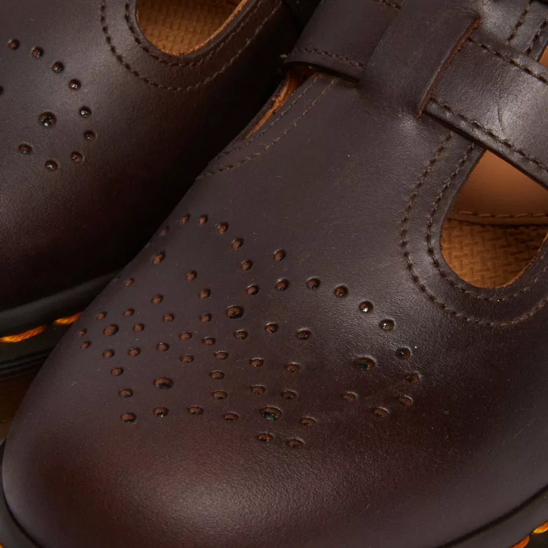 Black flat shoes: Women's Mary Janes with double buckle detail, great for spring/summer comfort.