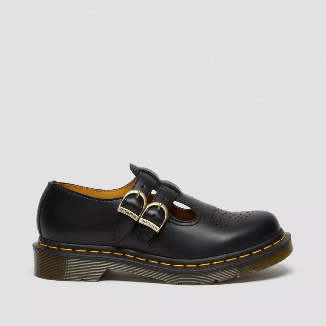 Women's black flat Mary Janes with two buckles, classic and comfortable for casual outfits.