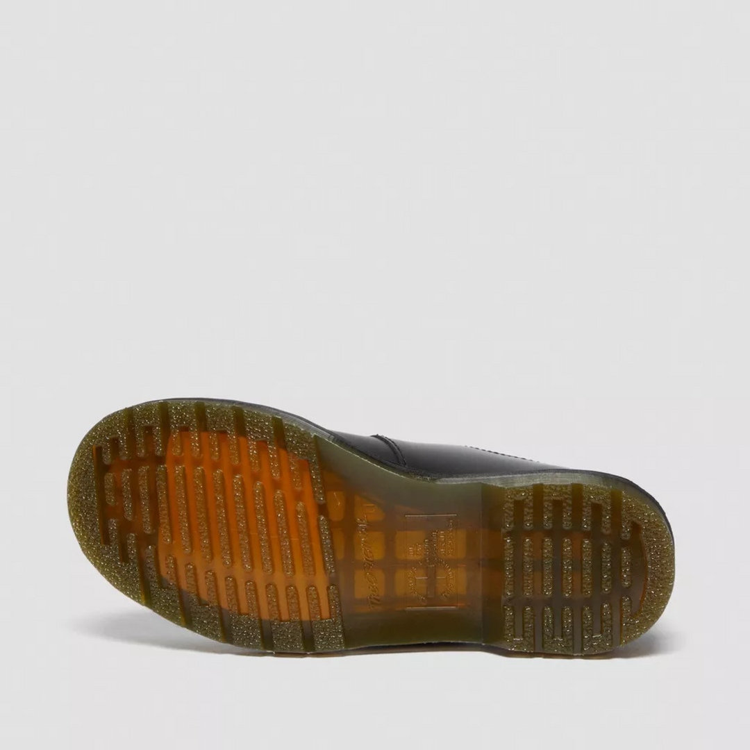 Top-down view of women's black flat Mary Janes, featuring prominent double buckle design.