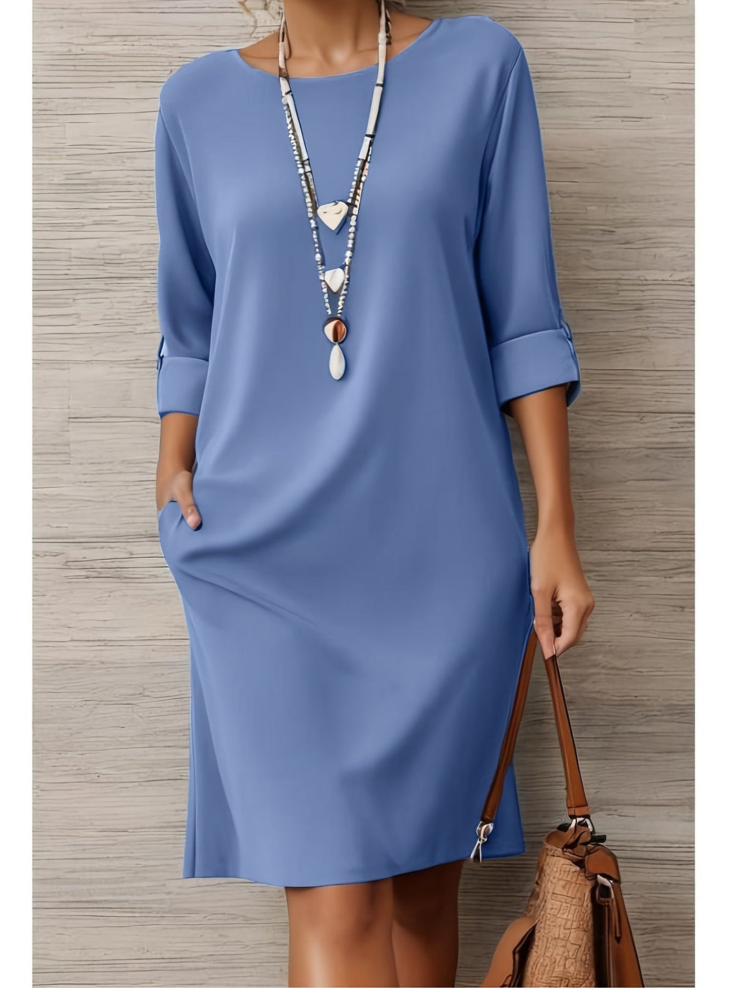 Full view of women's comfortable three-quarter sleeve dress, rounded neck, all-day wear.