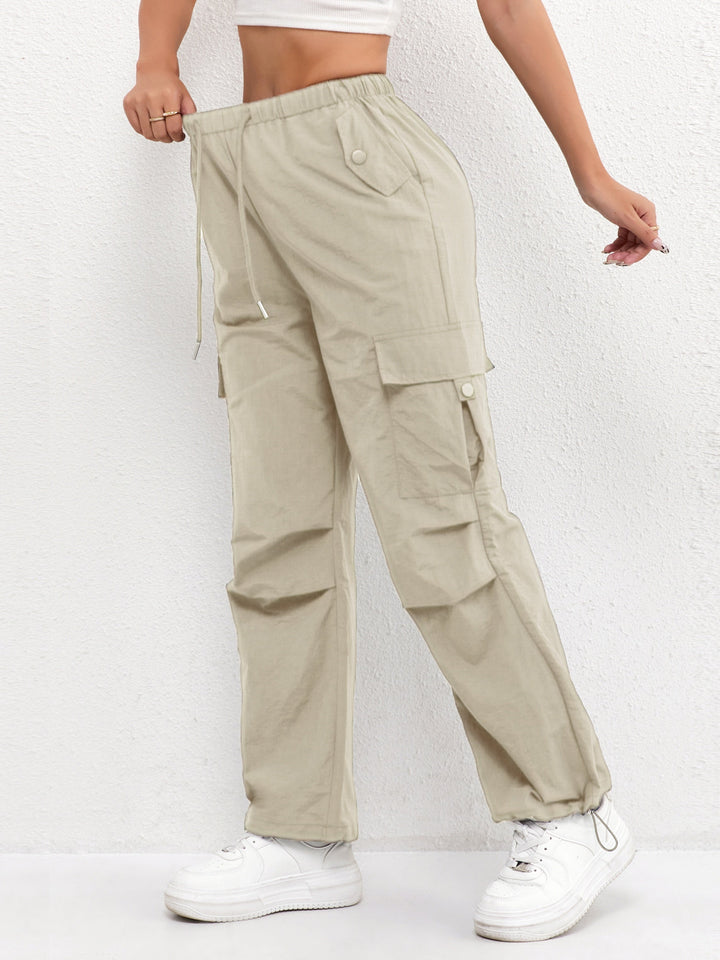 Trendy women's fashion parachute cargo pants with an adjustable drawstring waist, perfect for a chic street look.