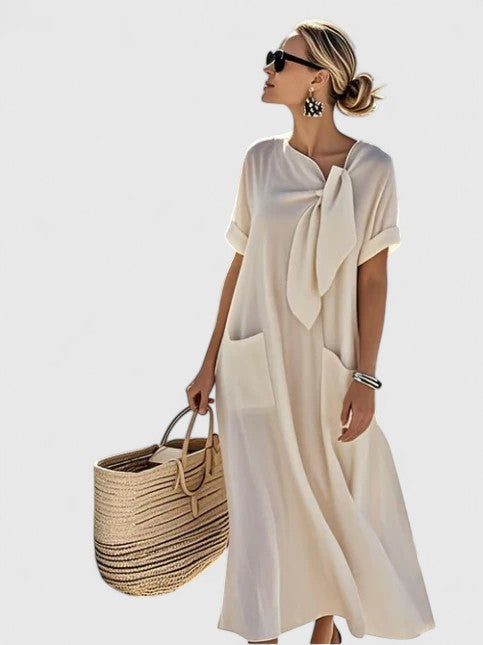 Versatile women's flowy summer dress with pockets, ideal for a relaxed casual look or dressed-up elegant style.