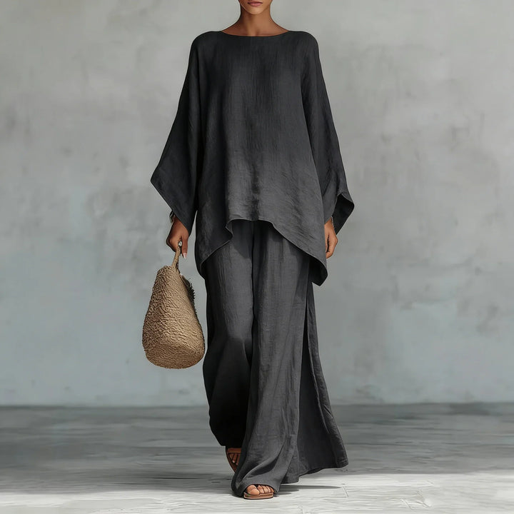 Women's oversized linen blend top and wide-leg pants set. Breathable fabric for a chic, comfortable summer look.