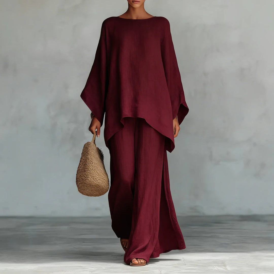 Casual women's linen blend two-piece set, an easy summer outfit. Features a relaxed top and wide-leg pants.