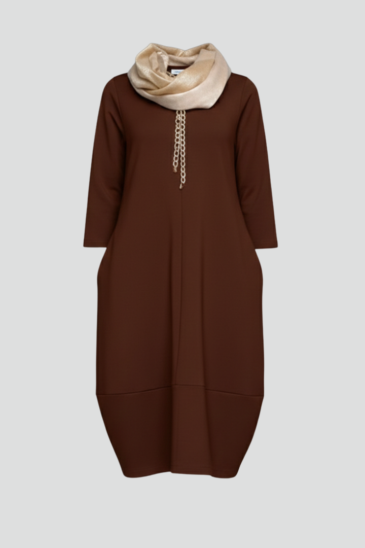 Women's effortless midi dress with pockets, round neck, and three-quarter sleeves for comfort.