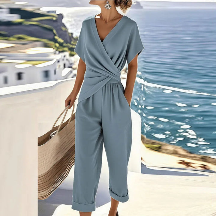 Elegant women's two-piece set with a flattering V-neck wrap top and chic cropped pants, ideal for spring & casual wear.