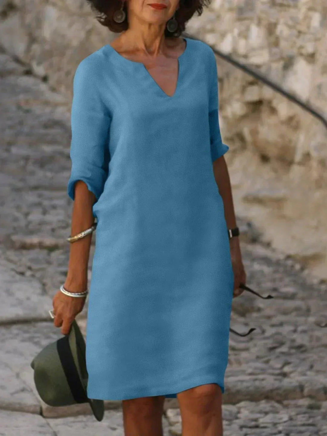 Women's comfortable v-neck mini dress, 3/4 sleeves. Relaxed fit, versatile short dress for everyday.