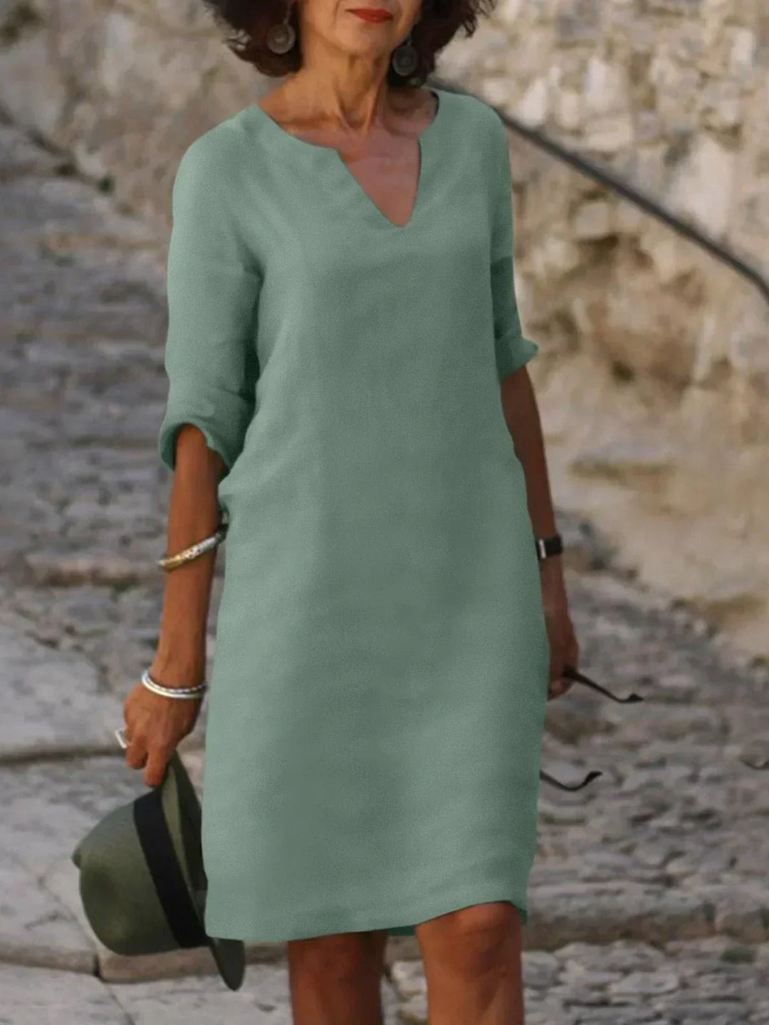 Plus size women's v-neck mini dress, 3/4 sleeves. Comfortable, relaxed fit, short dress for comfort.