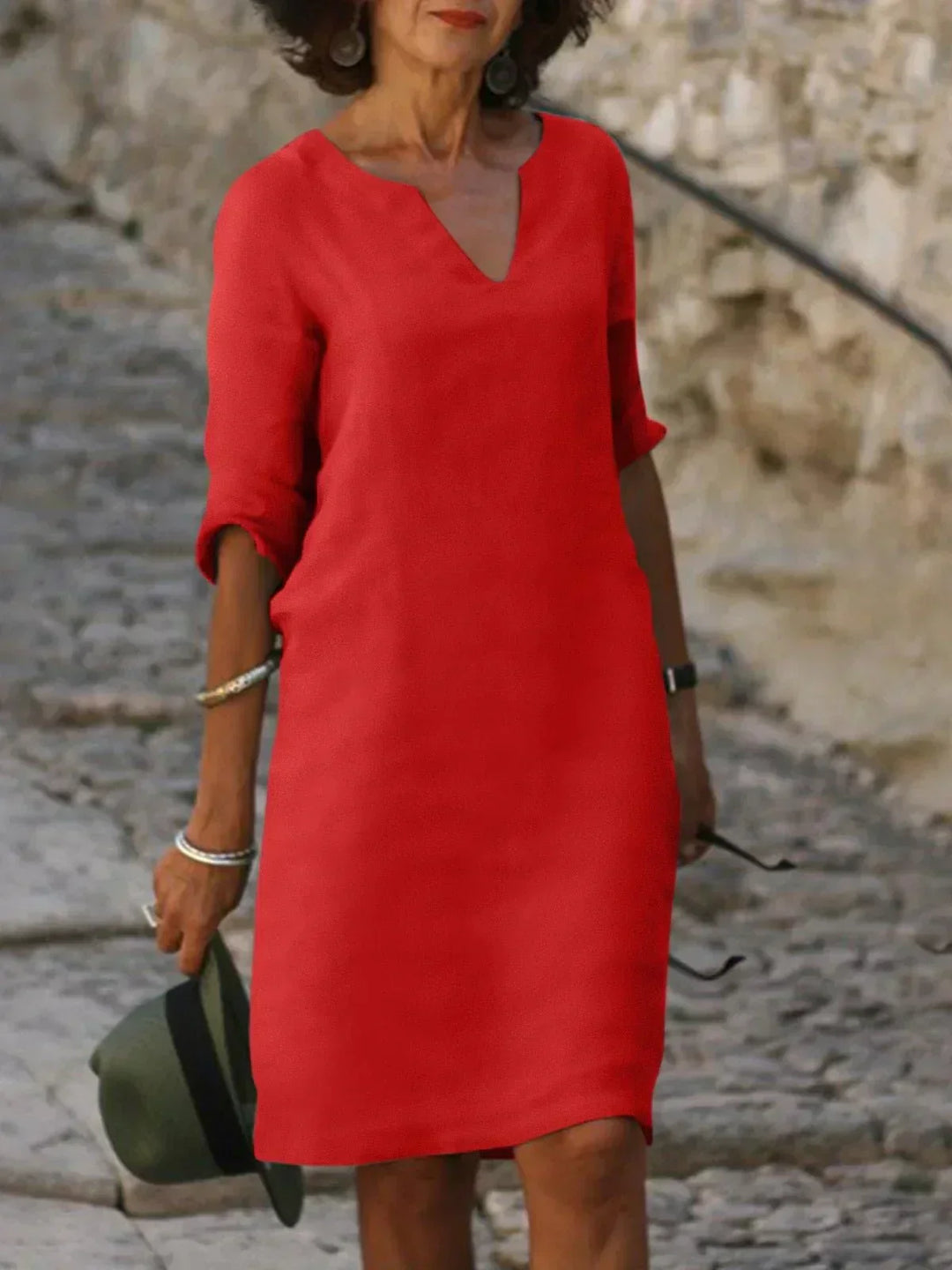 Women's short v-neck dress, 3/4 sleeves. Relaxed fit, ideal for casual, comfortable spring fashion.