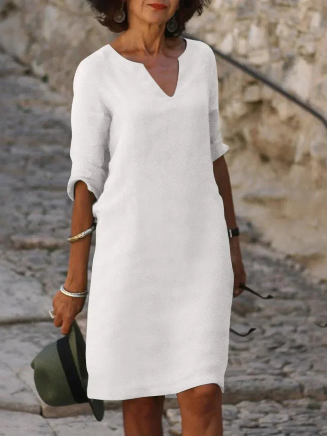 Effortless women's mini dress, v-neckline & 3/4 sleeves. Relaxed fit for casual, everyday comfort.