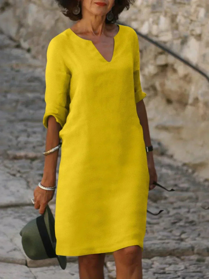 Effortless women's v-neck mini dress. 3/4 sleeve, relaxed fit, comfortable casual everyday wear.