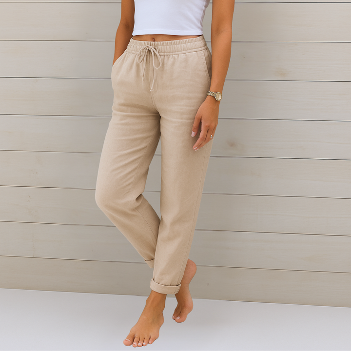 Relaxed fit women's comfort pants featuring an elastic waist & drawstring, ideal for versatile everyday style.