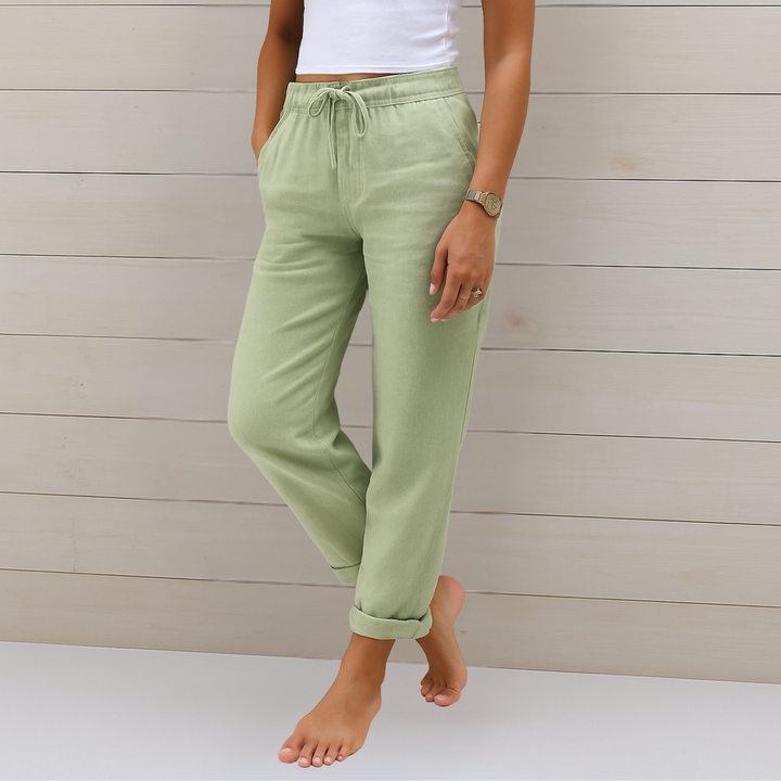Modern women's ankle pants with elastic waist & drawstring, offering a chic straight leg for office or casual wear.