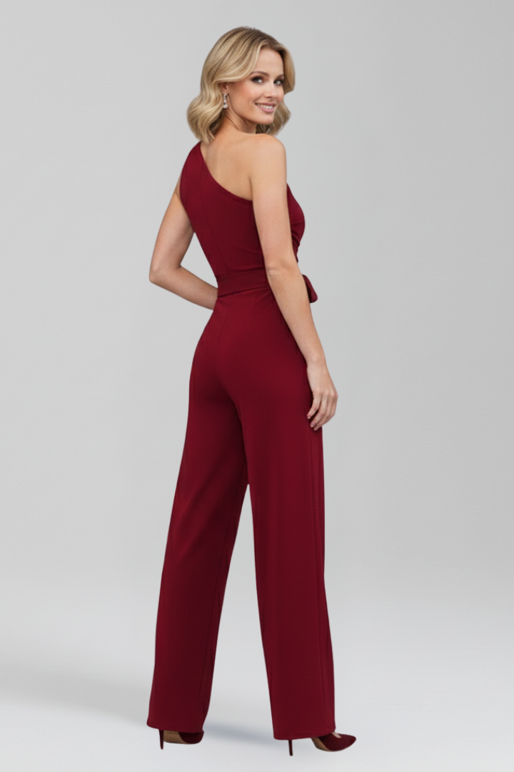 Elegant women's jumpsuit for modern fashion, featuring an asymmetric neckline, wide leg, and cinching waist belt.