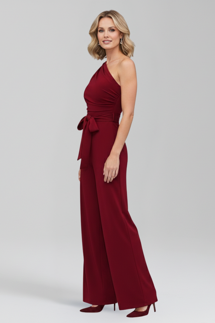 Versatile women's jumpsuit: sleeveless, asymmetric neckline, wide leg, and a flattering self-tie waist belt.