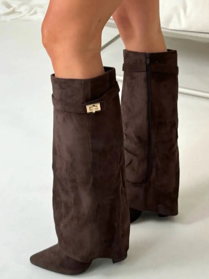 Black women's pointed toe knee-high boots with a sophisticated wedge heel for all-day comfort.