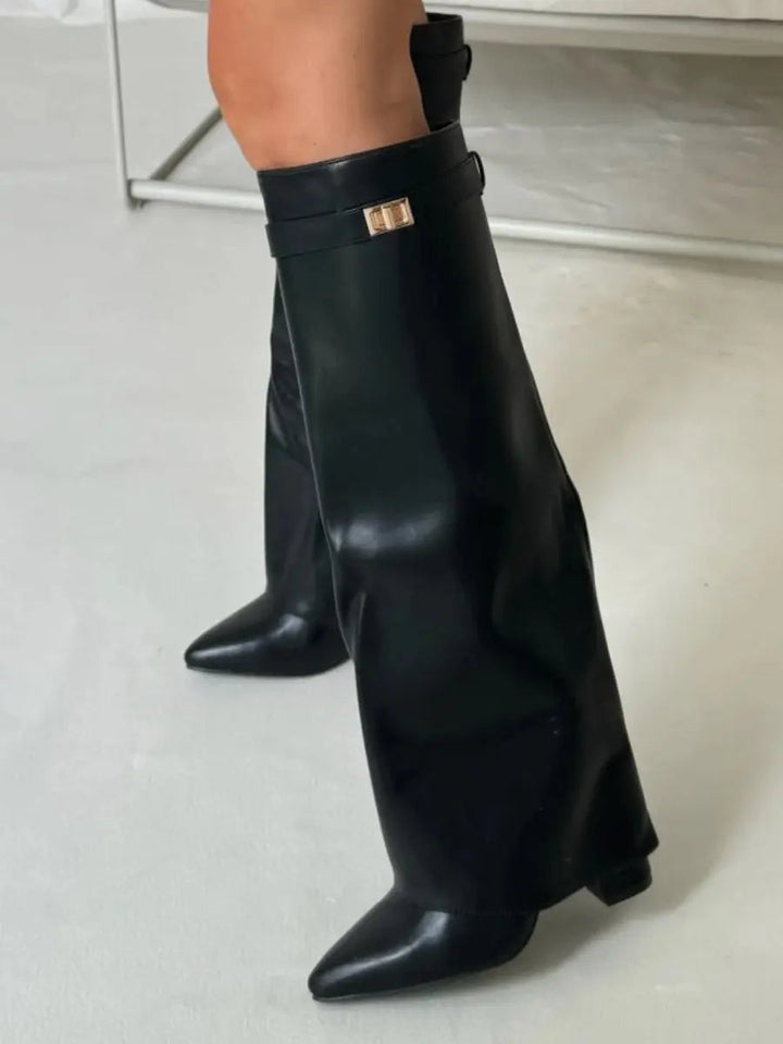 Fashionable women's beige knee-high boots with a pointed toe and an elegant wedge heel.