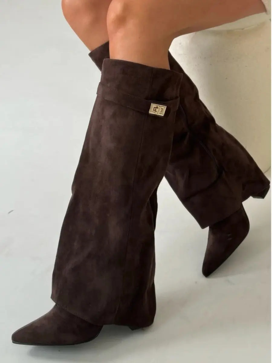 Stylish women's brown wedge heel knee-high boots with a pointed toe, perfect for winter wear.