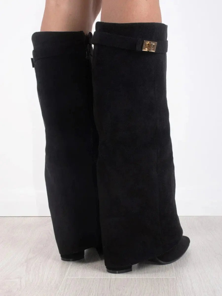 Beige women's footwear: stylish knee-high boots with a pointed toe and comfortable wedge heel.