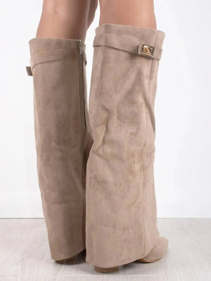Stylish women's knee-high boots in black with a pointed toe and elegant wedge heel design.