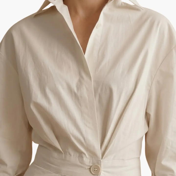 Smart casual women's shirt dress, elegant button front and defined waist, ideal for versatile everyday fashion.