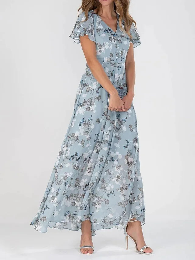 Beautiful women's floral flutter maxi dress. V-neck, printed, and elegant for summer, beach, party, or wedding guest.